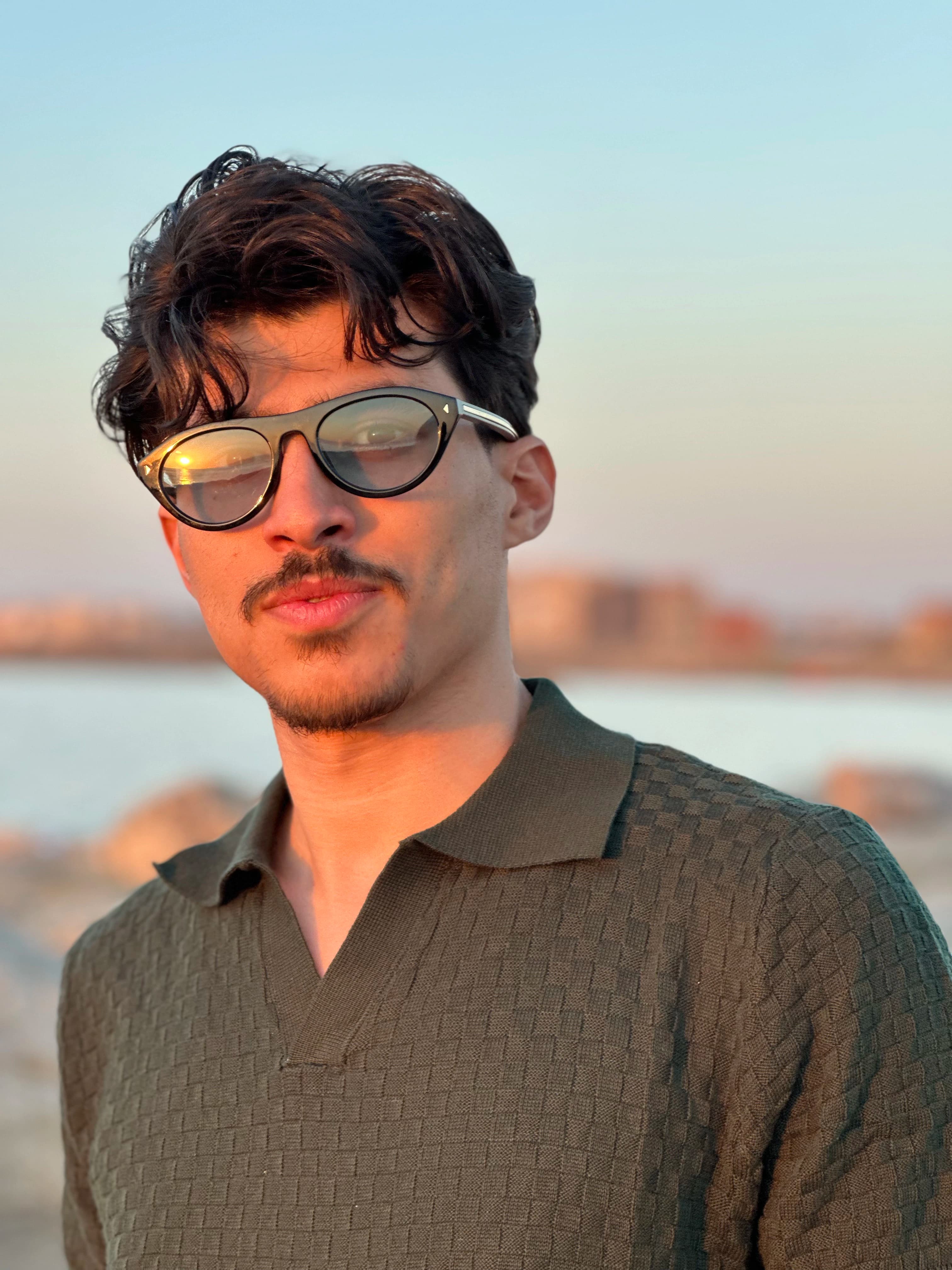 Man wearing sunglasses at the beach